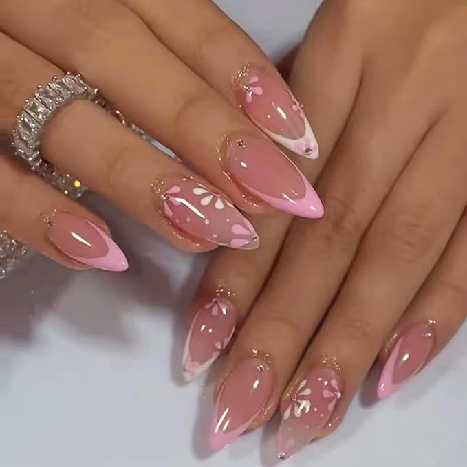 Eclectic floral nail designs featuring a mix of colors and patterns on each nail.


