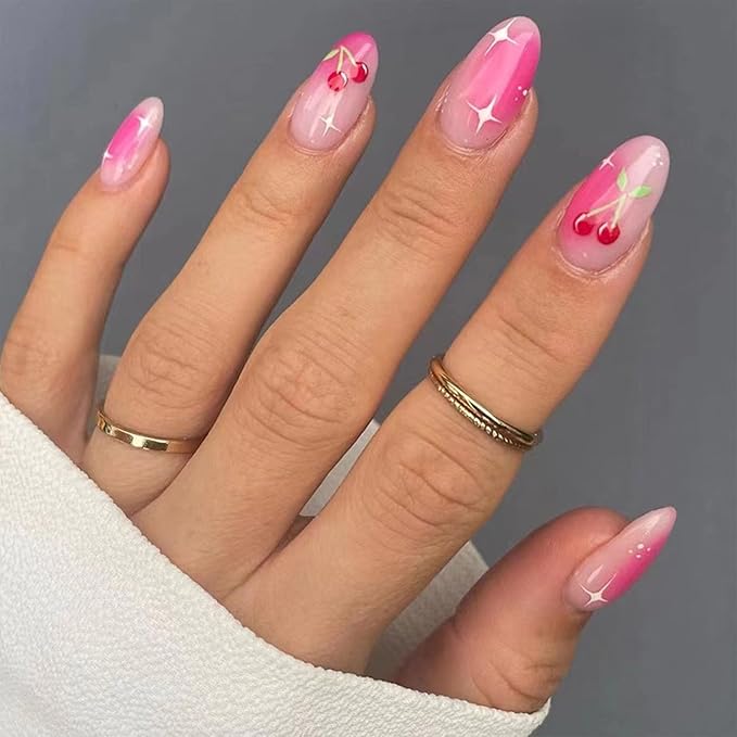 Trendy cow print nails combined with vibrant pink polish for a bold summer statement.