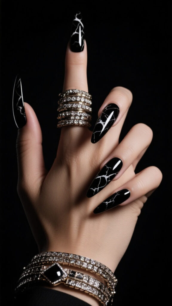 Black marble coffin nails with glossy finish, dramatic and glamorous nail design.